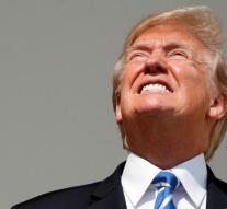 Donald Trump looks straight into the sun during eclips