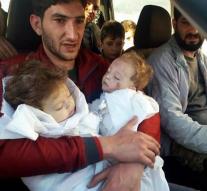 Father holding dead twins in his arms after poison gas attack Syria