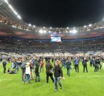 Football supporters on the field in Paris