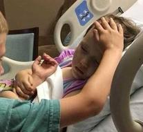 Heartbreaking picture: boy (6) says goodbye to dying sister (4)