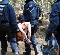 Police drags environmental activists from forest