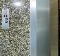 Woman falls meters down elevator shaft