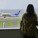 Passenger Tries to Open Plane's Emergency Door Mid-Flight, Prompting Intervention