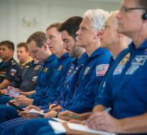 Astronauts back on Earth