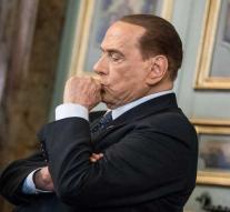 Berlusconi taps voter on the fingers