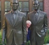 Bill Clinton picks up between two George W. Bushs