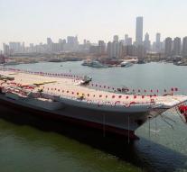 China presents home-made aircraft carrier