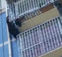 Dangling child (2) rescued from balcony