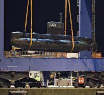 Denen investigates submarine with scanner