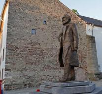 Fire at statue Marx in Trier