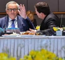 Juncker holds Selmayr hand over head