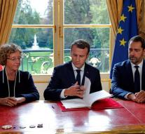 Macron signs revised labor law