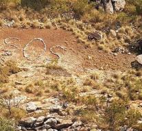 Mystery around SOS sign of boulders