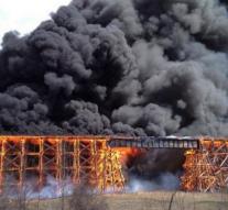 Railway bridge in flames