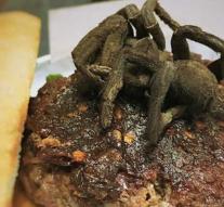 Restaurant shocking guests with a burger with fried tarantula