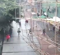 Scaffolding falls on busy street China
