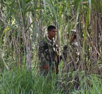 Soldiers walk in Colombia rebel ambush