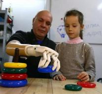 Son designing artificial arm for father