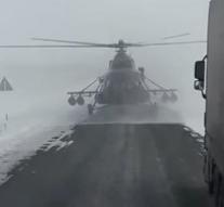 Stray combat helicopter lands on road
