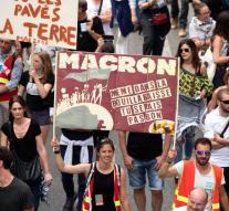 Tens of thousands argue in Paris against Macron