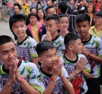 Thai football players from cave back to school
