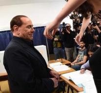 Topless activist turns up for voting Berlusconi