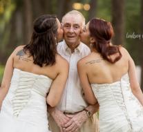 Twin sisters take wedding photos in scene for demented father