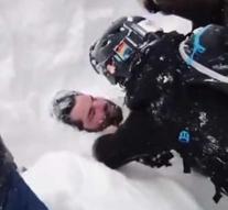 Wonderful moment: snowboarder is recovered after avalanche