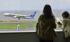 Passenger Tries to Open Plane's Emergency Door Mid-Flight, Prompting Intervention