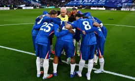 Referee's Involvement in Chelsea Team Huddle Sparks Controversy