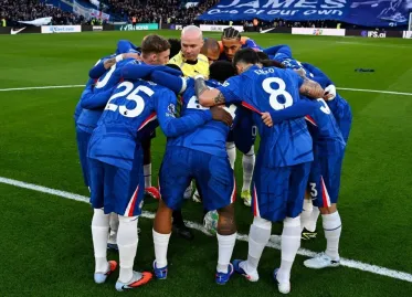Referee's Involvement in Chelsea Team Huddle Sparks Controversy