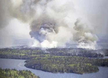 Thousands Flee as Wildfires in Canada Force Evacuations and State of Emergency Declared
