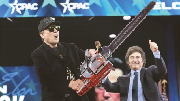 Elon Musk Performs Chainsaw Show on Stage