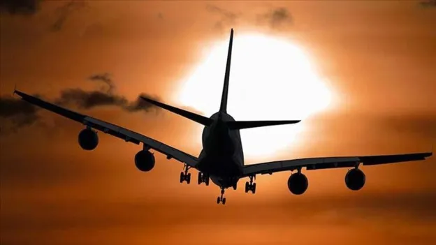 Passenger Attempts to Open Emergency Exit, Breaking Flight Attendant's Leg